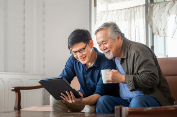 Older Plano homeowner talking with adult child about downsizing and staying socially connected