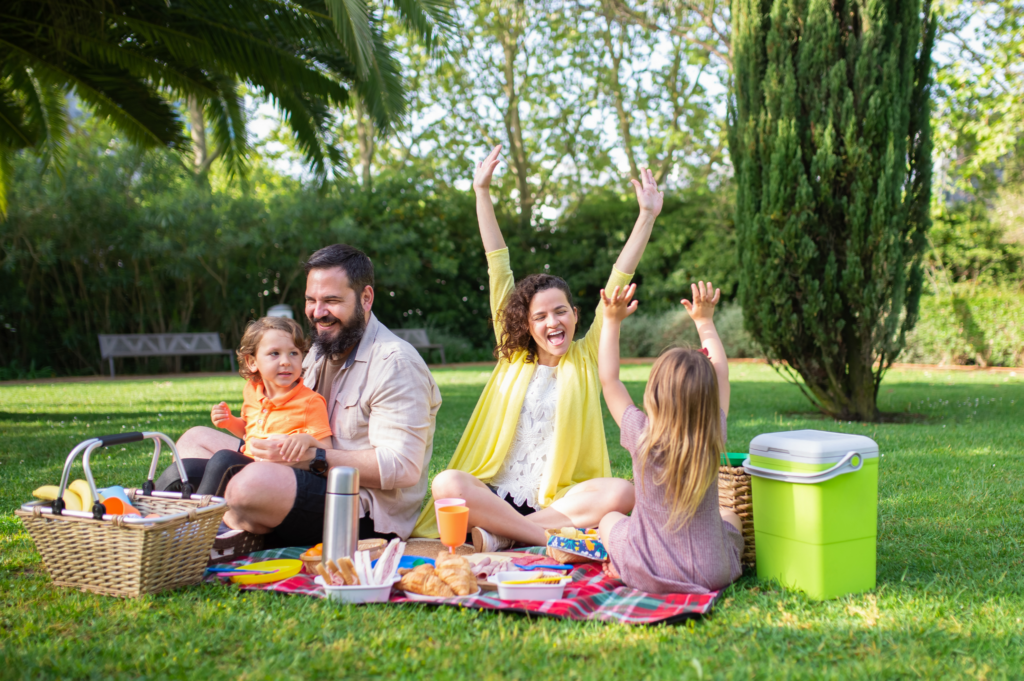 Families enjoying a neighborhood park in McKinney, Texas surrounded by mature trees and brick homes.