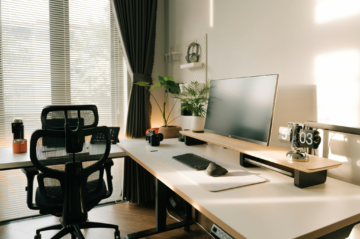 A bright, organized home office in a Plano home with natural light, modern furnishings, and flexible workspace.