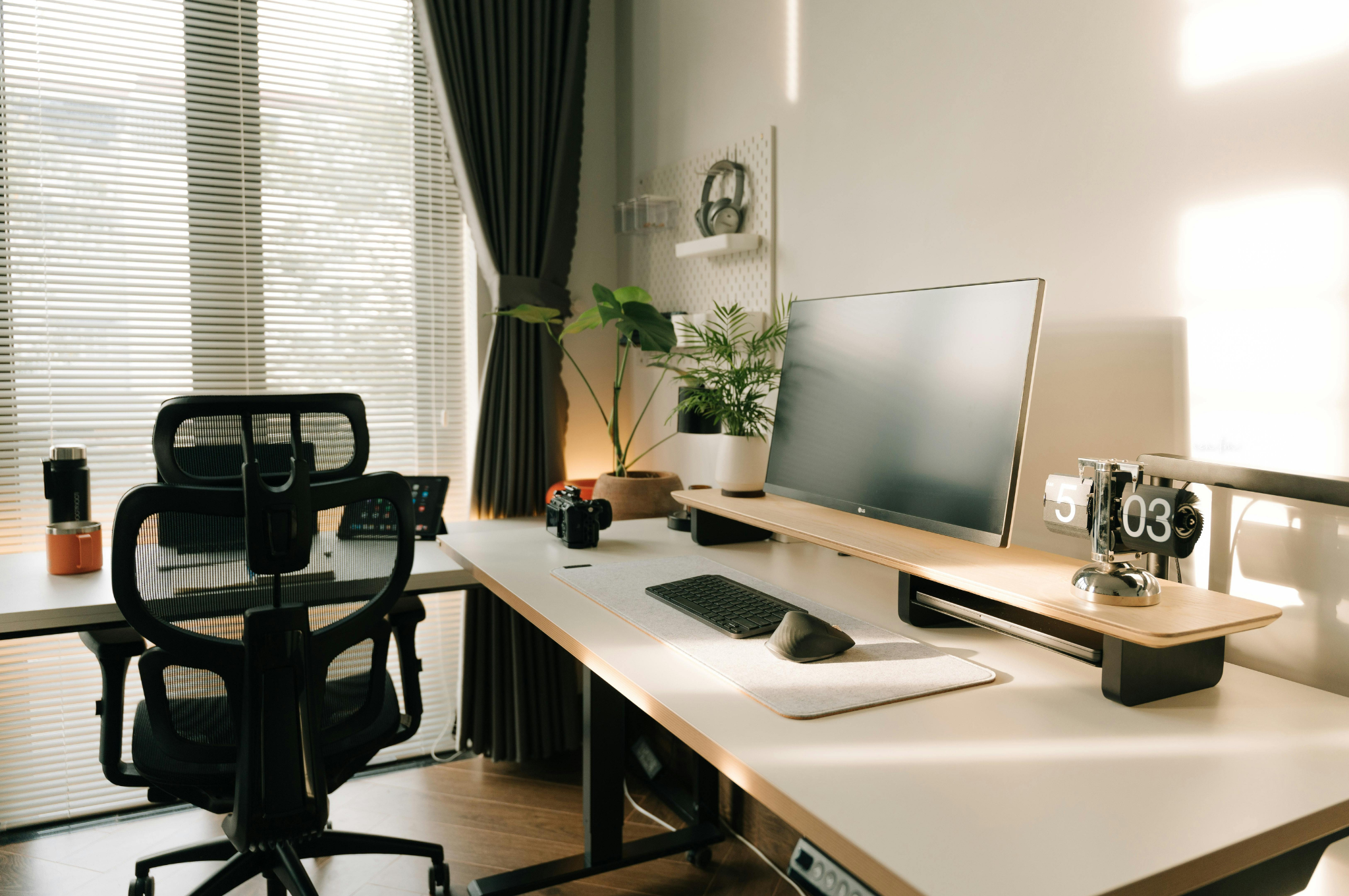 A bright, organized home office in a Plano home with natural light, modern furnishings, and flexible workspace.
