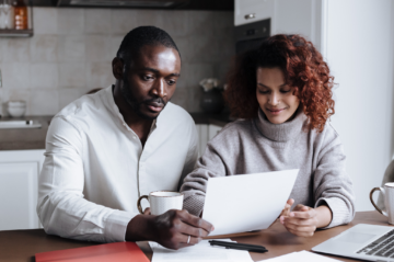 Plano Texas homeowner reviewing home equity and long-term financial plans at a kitchen table